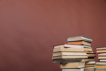 lots of books to study in the university library on a brown background