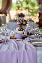 Beautiful floral arrangement and candles on wedding table in restaurant, copy space. Luxury wedding decorations