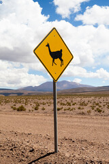 Chile, Atacama Desert, Los Flamencos National Reserve. Picture of a llama crossing sign in the Atacama Desert.