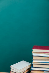 a lot of books to study in the university library on a green background