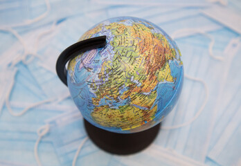 The globe on the background of medical masks