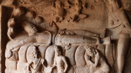 Mahishasuramartini Cave Temple. Sculptures carved in rock. Rock background
