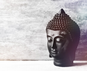 Meditating Buddha on wooden background. Soft focus. Close up. Copy space.	