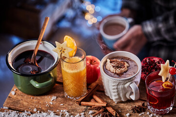 Assorted winter drinks on wooden table