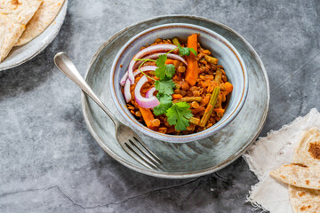 Vegan green lentil curry with paratha flatbread