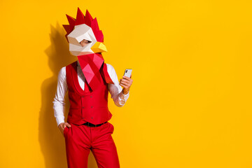 Photo of popular blogger guy hold telephone check feedback comments wear cock mask red suit...