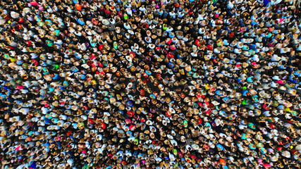Big crowd of people. People gathered together in one place. Top view from drone. - obrazy, fototapety, plakaty
