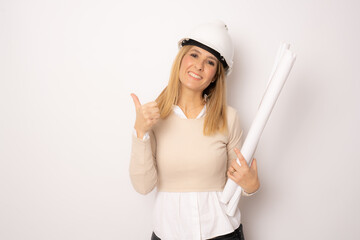 Woman architect with thumb up isolated on white background.