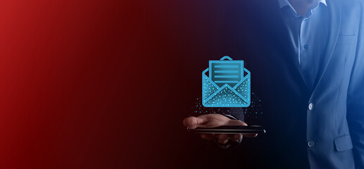 Businessman hand holding letter icon,email icons.Contact us by newsletter email and protect your...