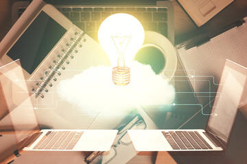 Double exposure of bulb drawing over table with phone. Top view. Concept of idea.