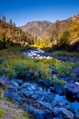 Fototapeta na wymiar Merced River. Autumn first snow in Yosemite National Park, California, USA.