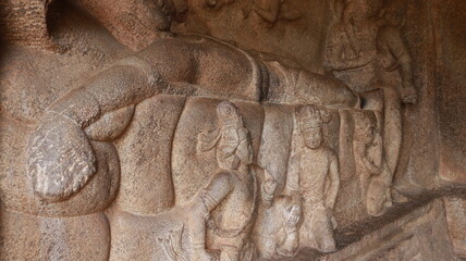 Mahishasuramartini Cave Temple. Hindu god in the form of a rock-cut cyanobacterium. The rock is located in the background