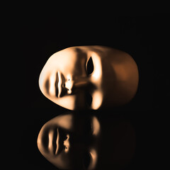 Mask in the dark with reflection. The concept of duality, riddle, dual, depression, loneliness,...