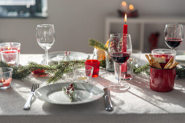 winter holidays, dinner party and celebration concept - close up of christmas table serving at home