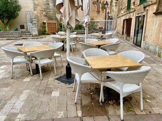 Empty table and chairs in the restaurant street terrace 