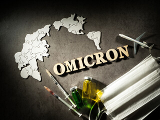 World map and Omicron words and medical supplies
