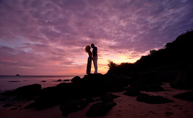 Romantic silhouette of a loving couple on honeymoon