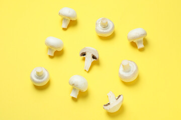 Flat lay composition with champignons on yellow background