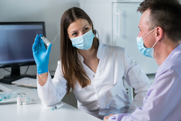 Man with face mask getting vaccinated, coronavirus, covid-19 and vaccination concept.