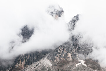 The top of the Dolomites Italian Alps covered with dense low clouds
