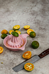 Freshly Squashed Orange Juice (Jeruk Peras in Indonesia) Serve on A Glass Above Brown Cement Table