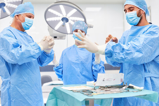 Surgery medical team in protective clothing before the operation