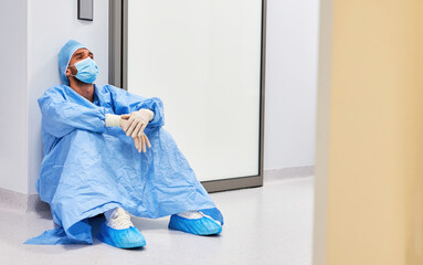 Exhausted surgeon or nurse takes a break