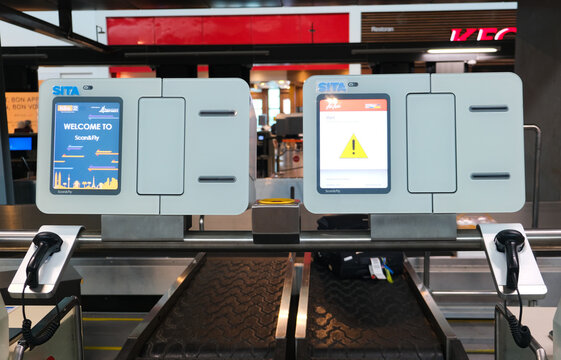 Selective focus picture and noise effect added at Air Asia luggage self check in counter during Covid-19 travel allow.