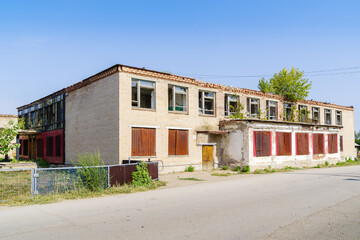 Abandoned building of the House of Culture in the Russian village. The picture was taken in Russia, in the Chelyabinsk region, in the village of Kalininsky