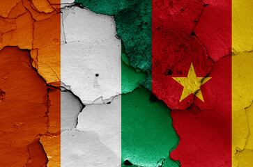 flags of Ivory Coast and Cameroon painted on cracked wall