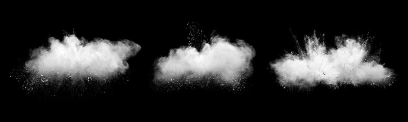 White powder explosion cloud against black background.White dust particles splash
