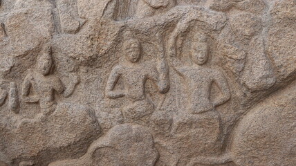 Sculptures carved in rock. The rock is located in the background