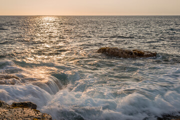 USA, Hawaii, Big Island of Hawaii. Wawaloli Beach Park, Ocean waves and rocky shoreline in late afternoon.
