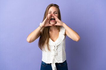 Young caucasian woman over isolated background shouting and announcing something