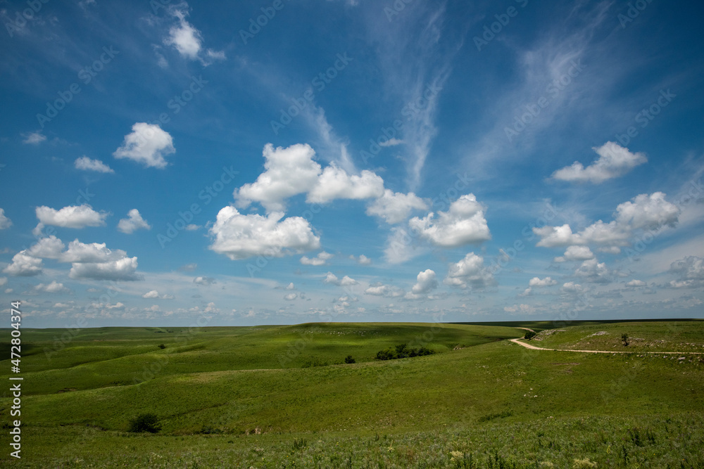 Wall mural Small road winding through the Flint Hills.