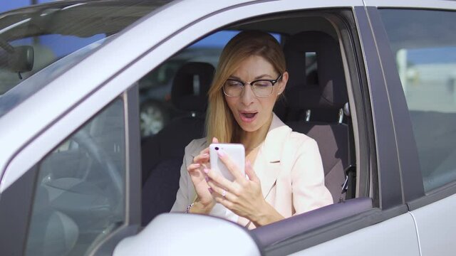 Excited attractive woman fundraiser in light suit and stylish eyeglasses shocked with sum her foundation collect for charity, help and support for other people, volunteering