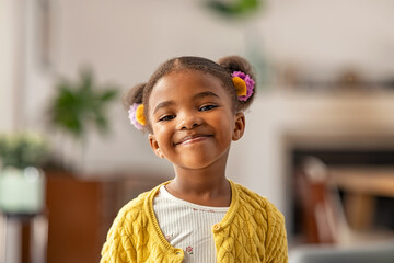 Cute little african american girl looking at camera - Powered by Adobe