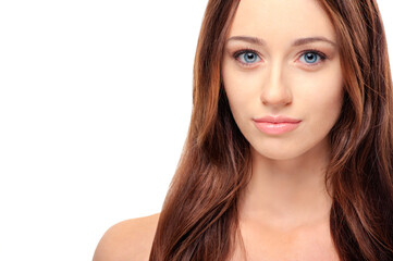 Obraz premium Natural beauty. Portrait of beautiful young shirtless caucasian woman with long hair looking at camera while standing against white background.