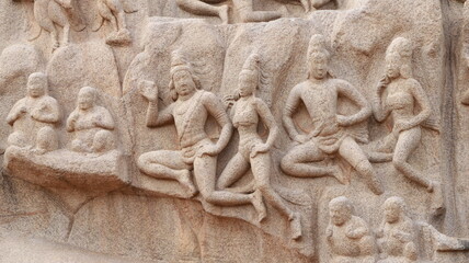 Sculptures carved in rock. The rock is located in the background