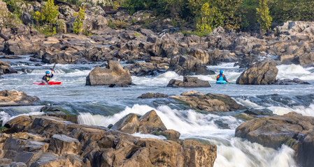 USA, Maryland, Great Falls, Potomac River, kayakers maneuvering the falls