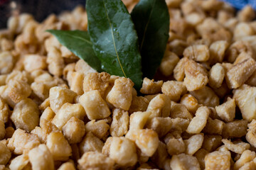 Cracklings Pork, are a specialty of cooked pork lard. This food is obtained from the rest of the adipose tissue. Cracklings or ciccioli in Italy