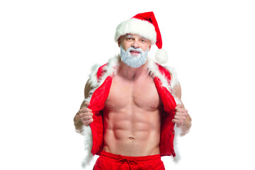 Christmas. Portrait of muscular sexy strong athlete in Santa Claus costume with gray beard posing showing his abs isolated on white background