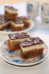 Cake with biscuits, chocolate and cream