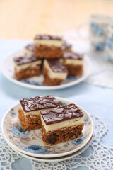 Cake with biscuits, chocolate and cream