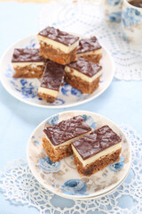 Cake with biscuits, chocolate and cream