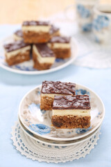 Cake with biscuits, chocolate and cream