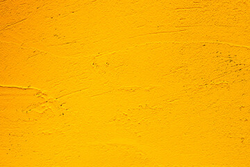 Yellow grunge background. Old plastered wall