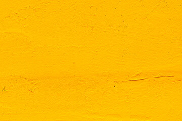 Yellow grunge background. Old plastered wall
