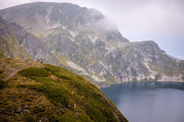 Beautiful landscape of the Seven Rila Lakes,Bulgaria. Amazing nature shot, mountains and lake.Reflecting water on sunny cloudy day. High quality photo