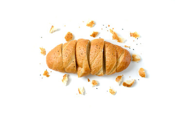 sliced sesame bread and bread crumbs on a white background